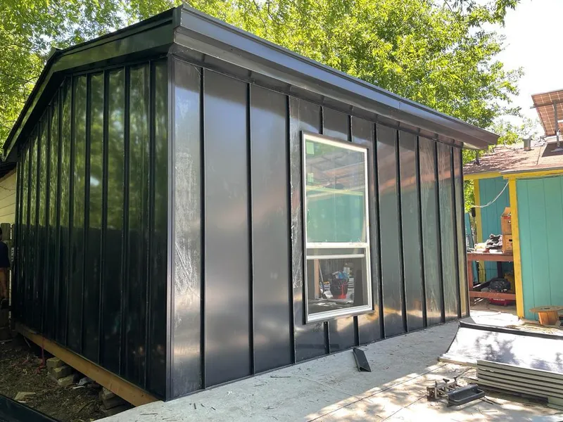 Black standing seam metal wall panels for Roof Inspection in Tomball