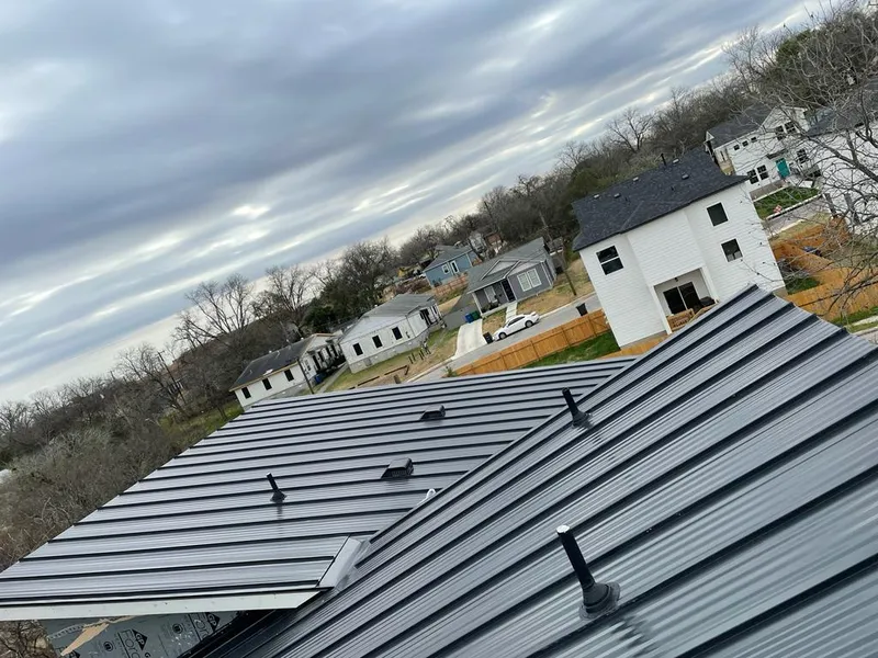 Standing seam metal roof panels with vents for Skylight Repair in Tomball